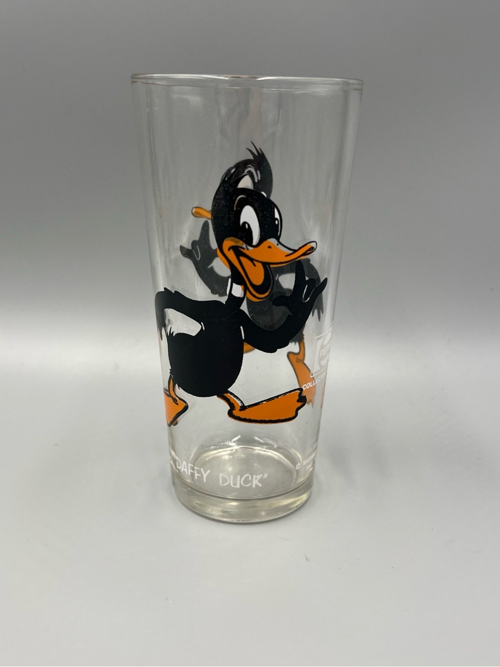 Pepsi Daffy Duck Clear Glass Tumbler with Black and Orange Artwork